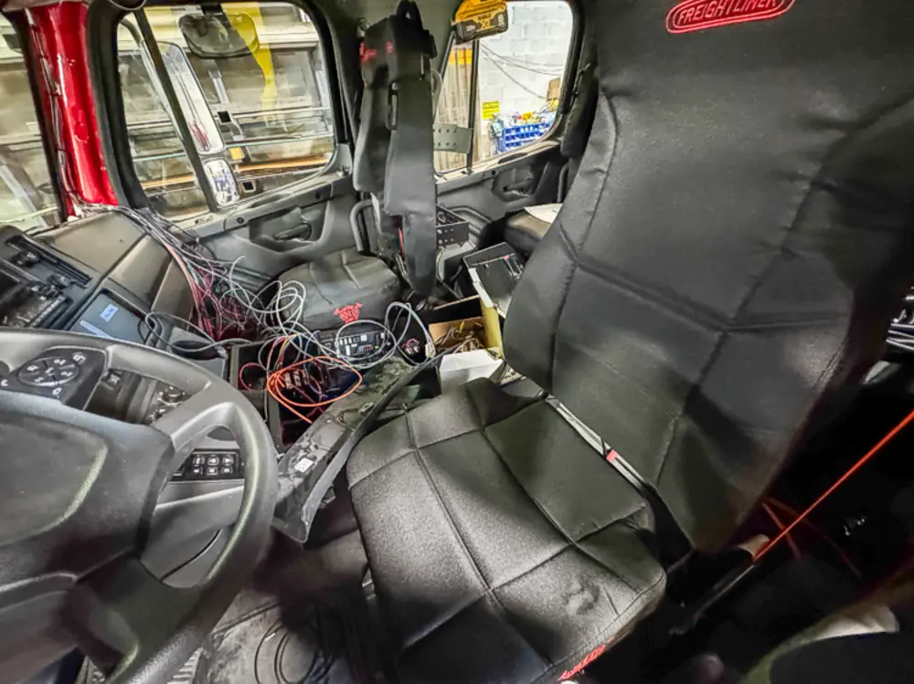 Diamond-plate body and step detail in production, photo 98 of 303.